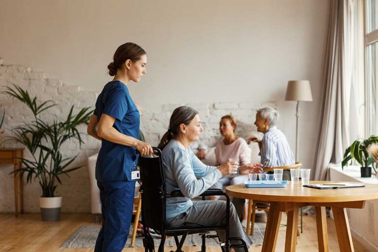 Older adults and family members organizing belongings together in a bright, cozy living room.